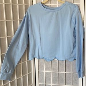 Blue scalloped hem sweatshirt